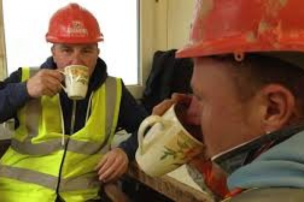 Professional builders with tea